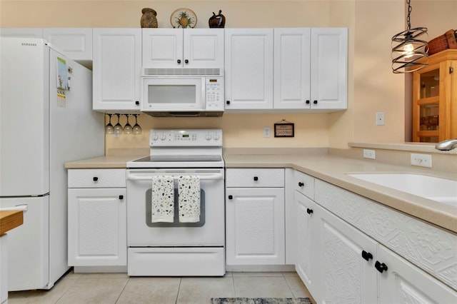 kitchen with white cabinetry, light tile patterned flooring, white appliances, and hanging light fixtures