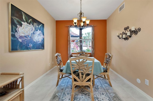 dining space featuring a notable chandelier