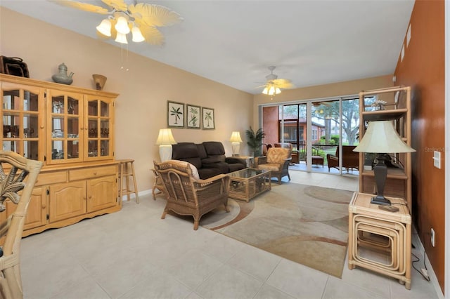 living room featuring ceiling fan and light tile patterned floors