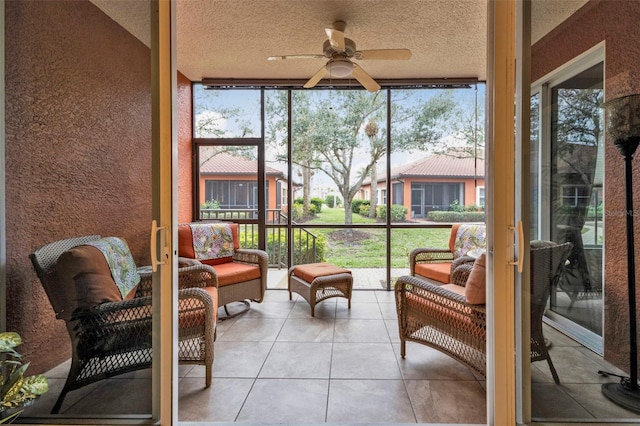 sunroom with plenty of natural light and ceiling fan