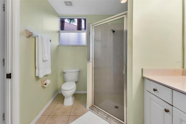 bathroom with toilet, tile patterned flooring, vanity, and walk in shower