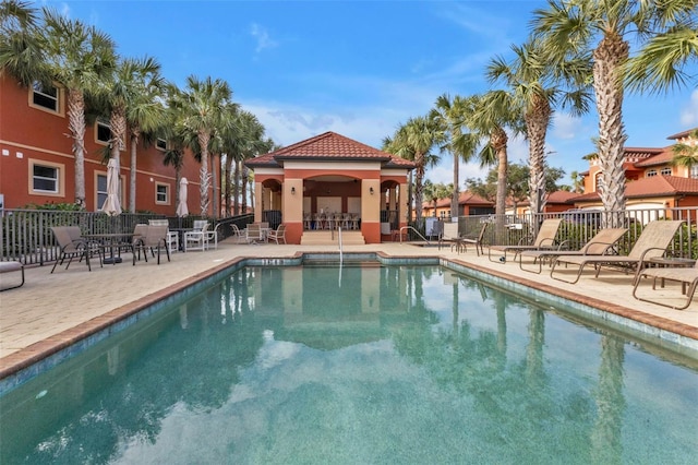 view of swimming pool featuring a patio area