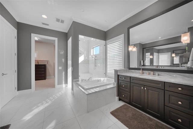 bathroom with vanity, crown molding, and separate shower and tub