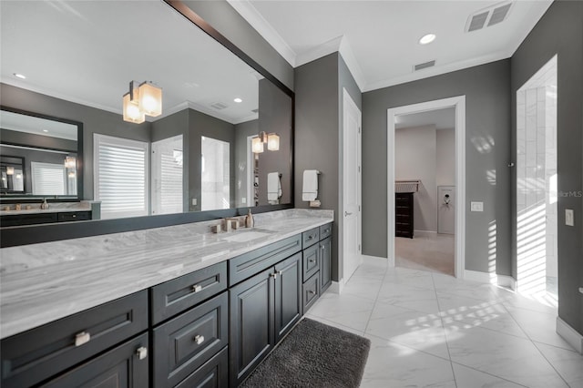 bathroom featuring ornamental molding and vanity