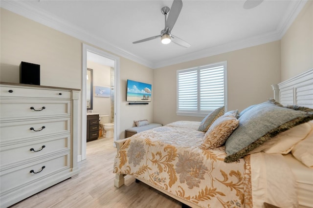 bedroom with light wood-type flooring, ceiling fan, ensuite bathroom, and crown molding