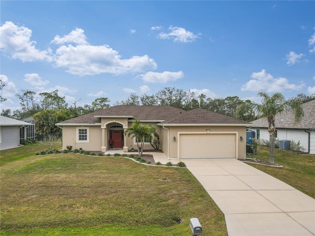 single story home featuring central air condition unit, a front yard, and a garage