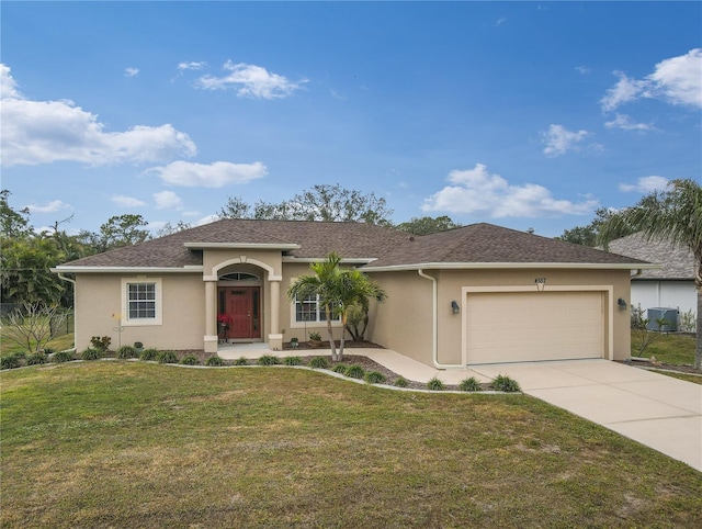 view of front of property featuring cooling unit, a front yard, and a garage