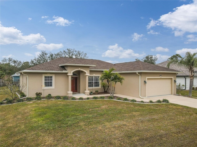 single story home featuring a garage and a front lawn