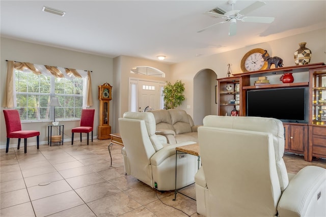 tiled living room featuring ceiling fan