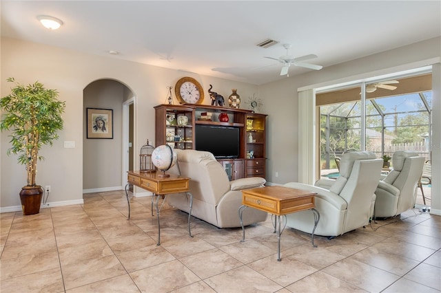 sitting room with ceiling fan and light tile patterned flooring