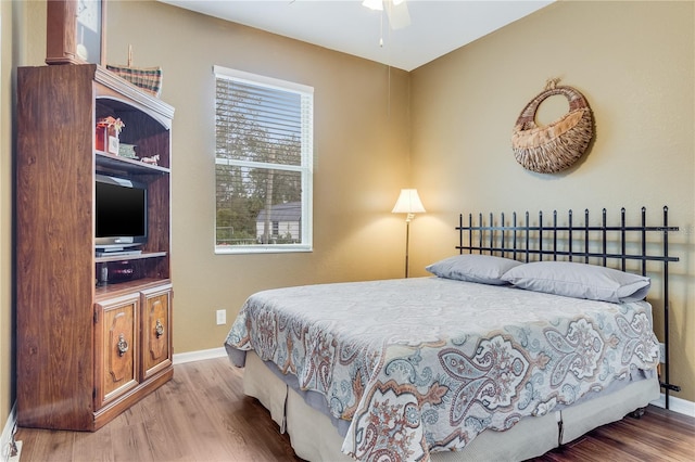 bedroom featuring hardwood / wood-style floors and ceiling fan