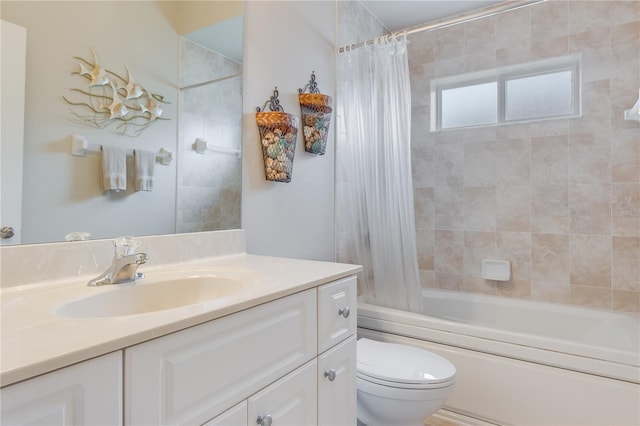 full bathroom with vanity, shower / bath combo, and toilet