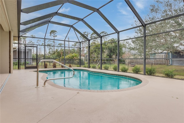 view of swimming pool featuring a lanai and a patio area