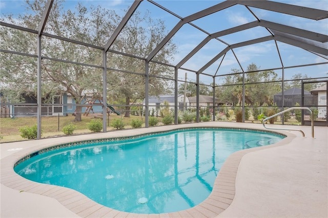 view of swimming pool with glass enclosure