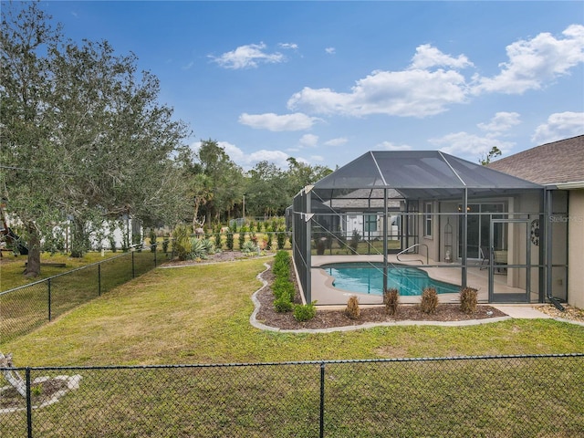 view of swimming pool featuring a lanai and a lawn