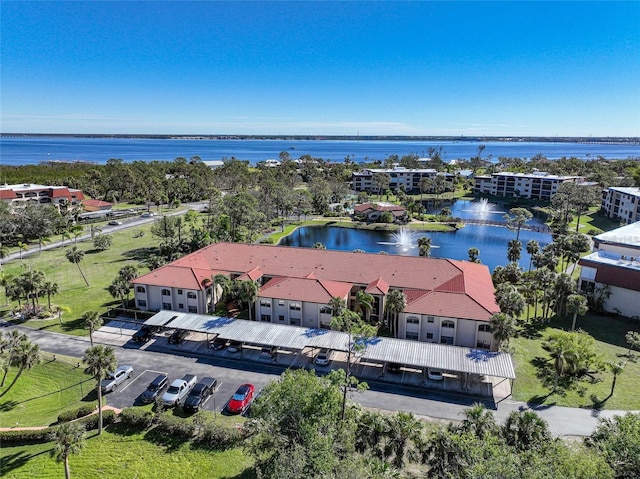 drone / aerial view with a water view