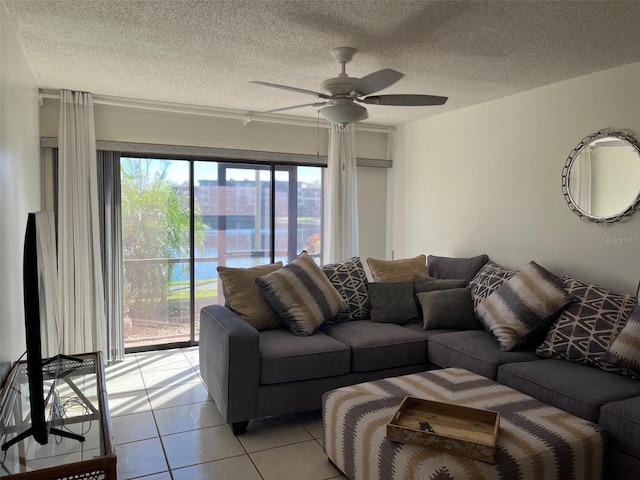 tiled living room featuring a textured ceiling and ceiling fan