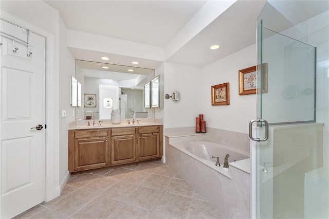 bathroom featuring tile patterned flooring, separate shower and tub, and vanity