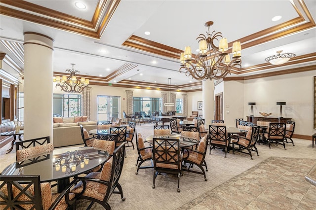 dining room featuring decorative columns, an inviting chandelier, a raised ceiling, and ornamental molding