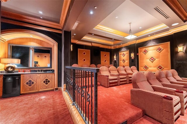 carpeted cinema with sink and ornamental molding