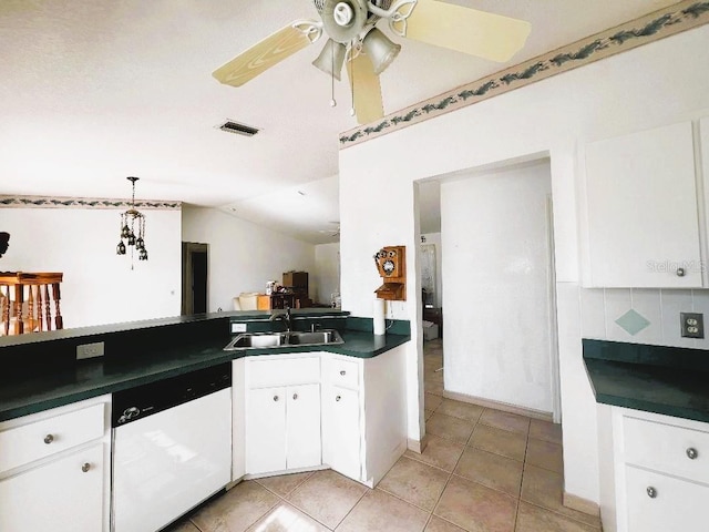 kitchen with visible vents, dark countertops, ceiling fan, white dishwasher, and a sink