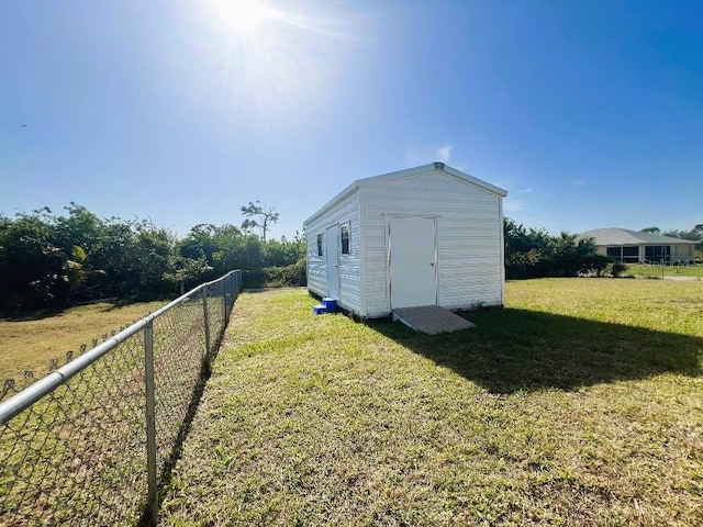 view of shed featuring fence