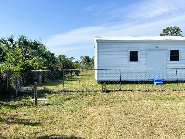 exterior space featuring fence and an outdoor structure