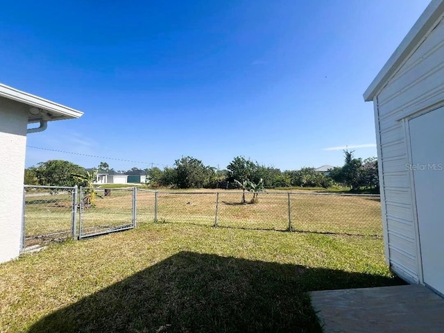 view of yard with a gate and fence