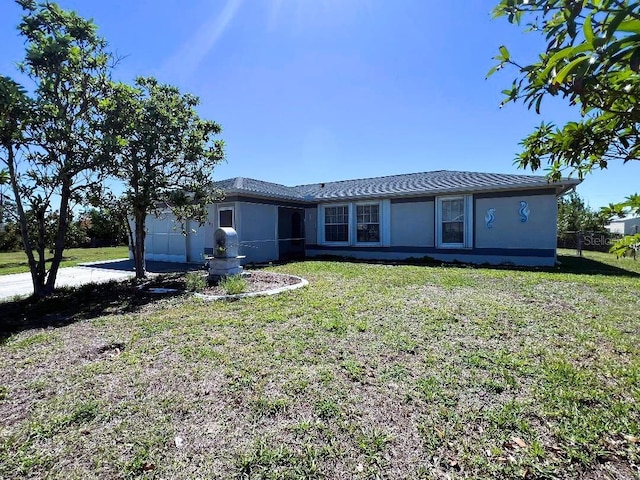 12143 Du Barry Ave, Port Charlotte, FL 33981 - rear view of property with a yard and stucco siding