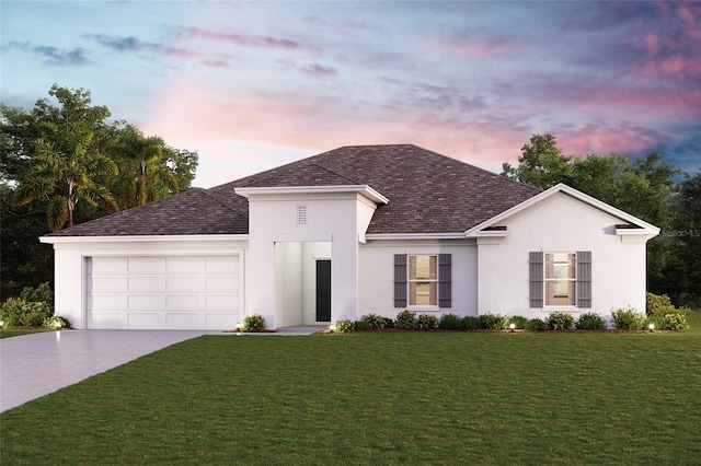 view of front of home featuring a lawn and a garage