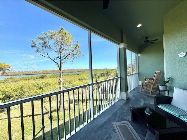 balcony featuring ceiling fan