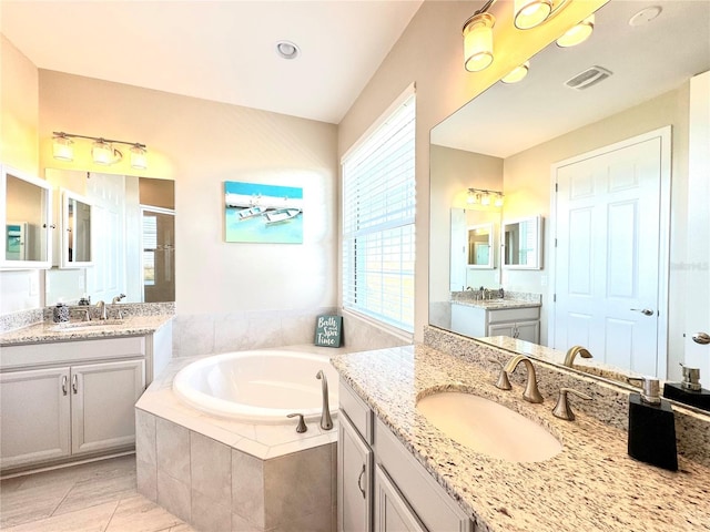 bathroom with separate shower and tub, tile patterned flooring, and vanity