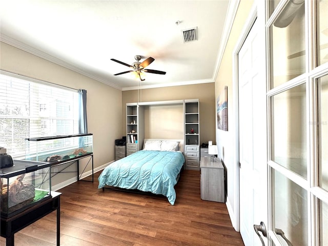 bedroom featuring dark hardwood / wood-style floors, ceiling fan, and ornamental molding