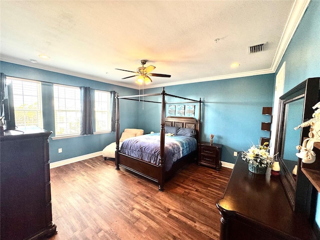 bedroom with a textured ceiling, dark hardwood / wood-style floors, ceiling fan, and ornamental molding