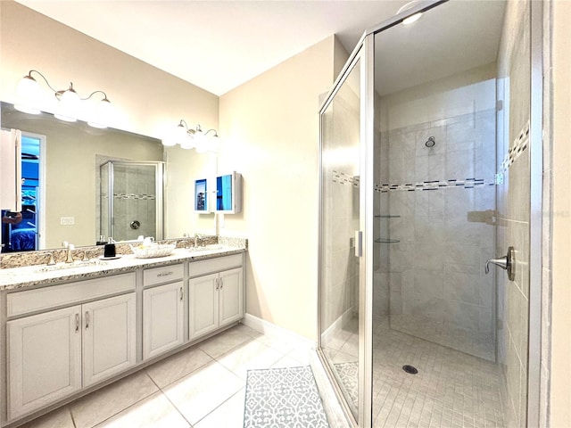 bathroom with vanity, tile patterned floors, and an enclosed shower