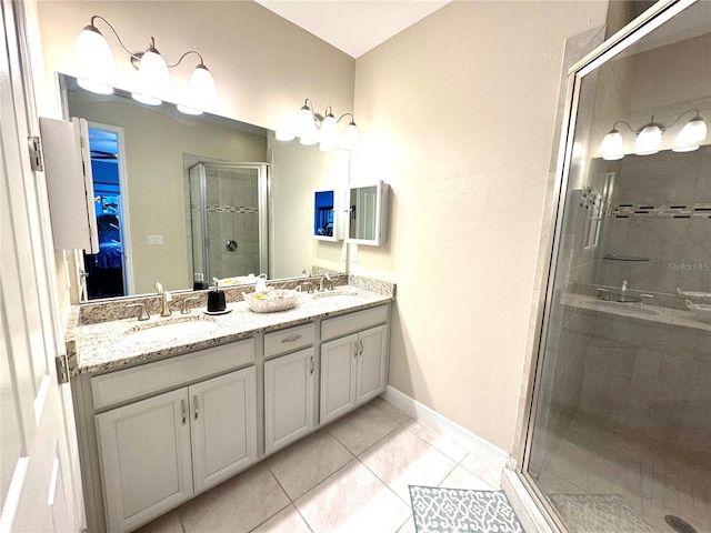 bathroom with vanity, tile patterned floors, and a shower with shower door