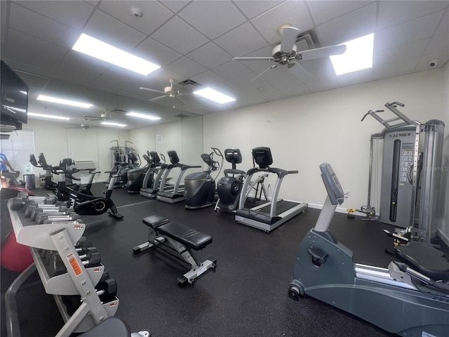 exercise room featuring a paneled ceiling and ceiling fan