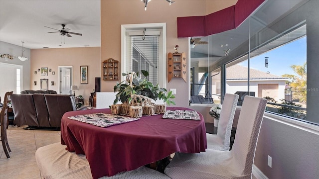 dining room with ceiling fan, light tile patterned floors, and plenty of natural light