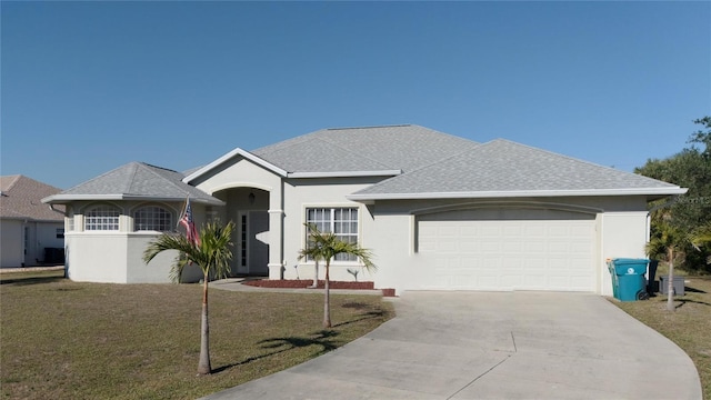 ranch-style house with a front yard and a garage