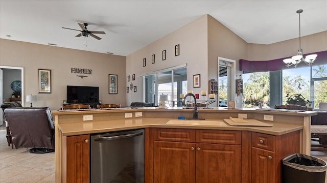 kitchen featuring ceiling fan with notable chandelier, dishwasher, decorative light fixtures, sink, and light tile patterned floors