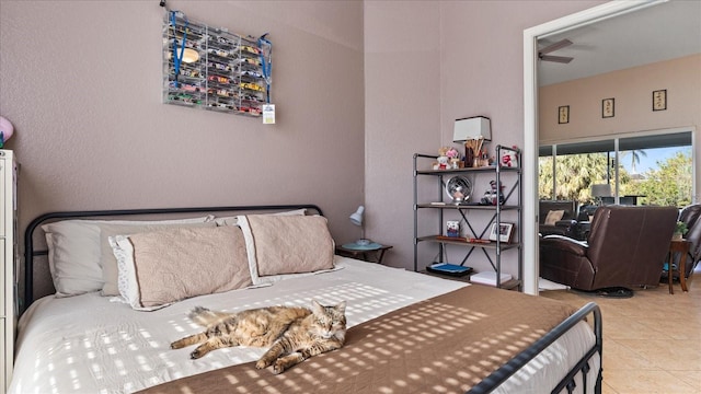 tiled bedroom featuring access to exterior