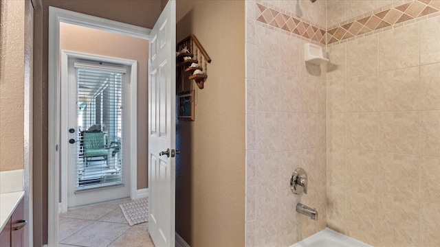 bathroom featuring vanity, tub / shower combination, and tile patterned floors