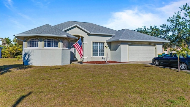 view of front of property featuring a front lawn and a garage