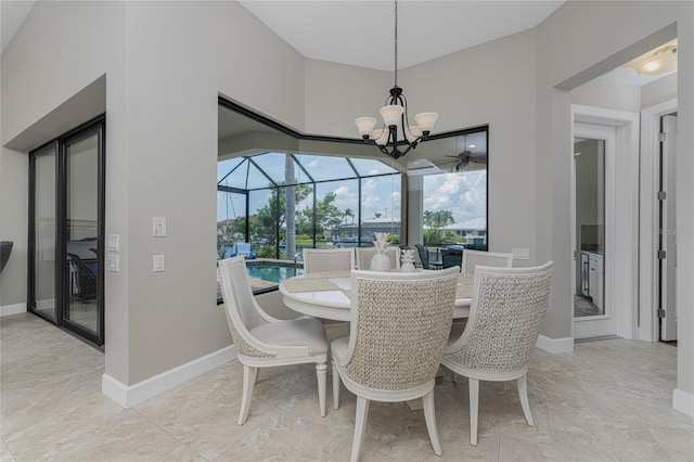 dining area with plenty of natural light and a notable chandelier