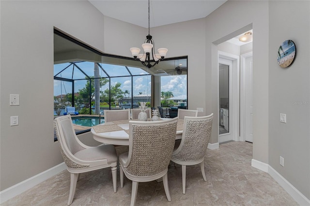 dining space featuring an inviting chandelier