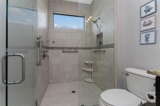 bathroom featuring toilet and an enclosed shower