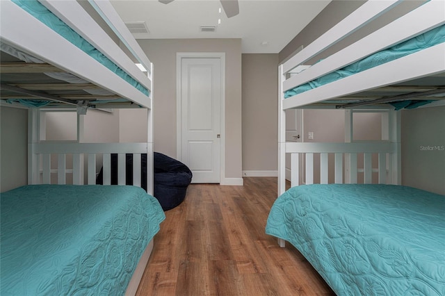 bedroom featuring ceiling fan and wood-type flooring