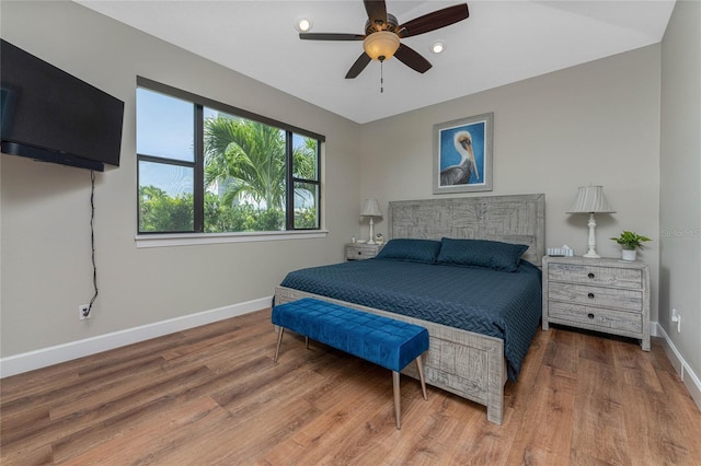 bedroom featuring ceiling fan and hardwood / wood-style floors