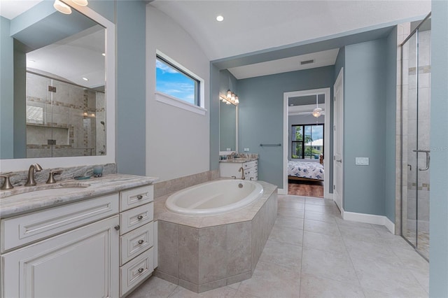 bathroom featuring tile patterned flooring, shower with separate bathtub, vanity, and a healthy amount of sunlight