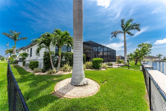 view of yard featuring glass enclosure